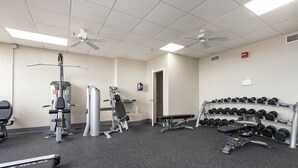 A gym with exercise equipment, treadmills, and a rack of dumbbells. - Phoenix Iii 3075 1 Bedroom Condo (Orange Beach)