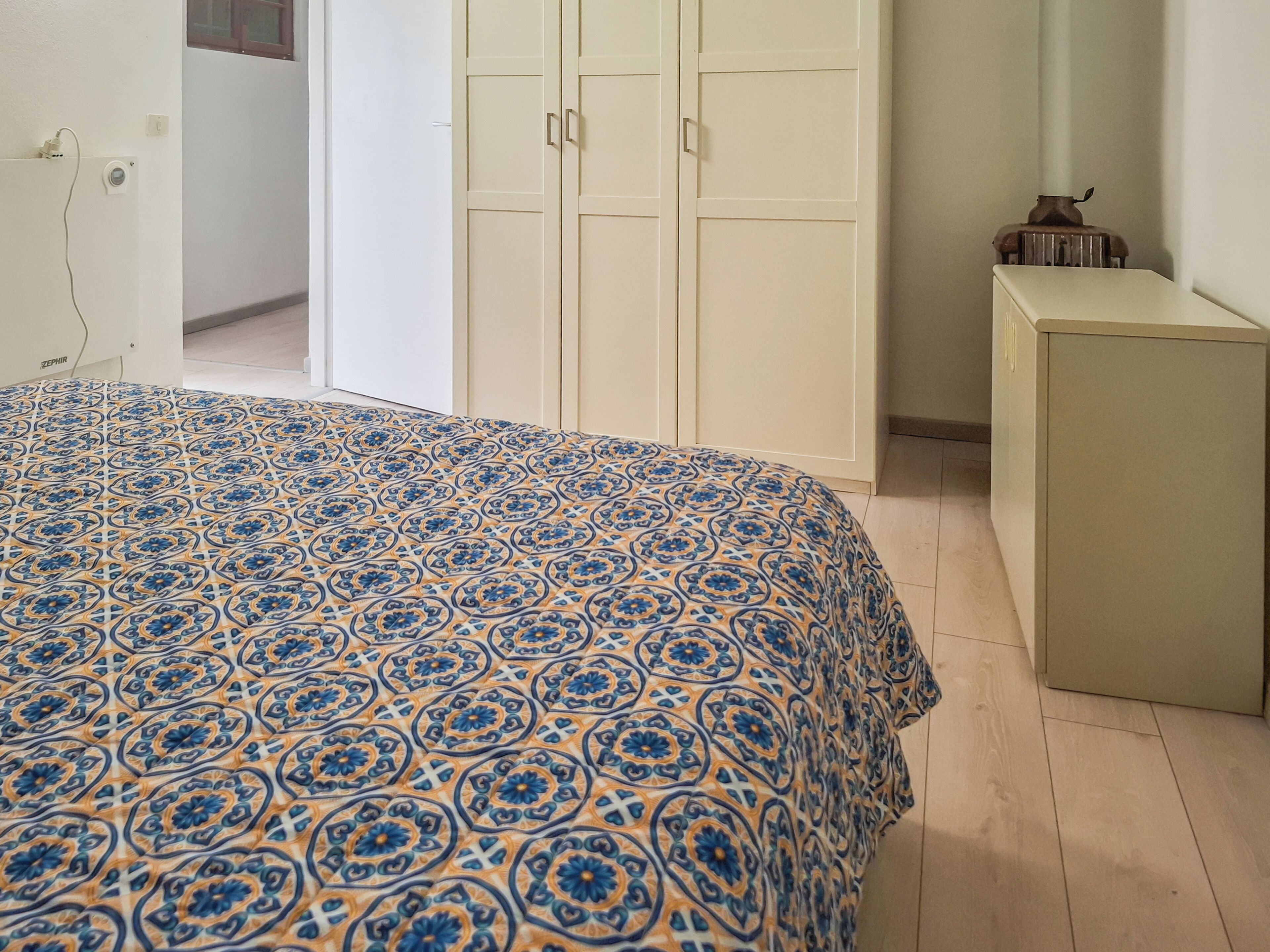 Condo | Tabla de planchar con plancha, wifi gratis y ropa de cama 
