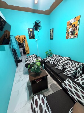 Smart TV, books - Content Luxury Stay – Where Comfort Meets Luxury (Spanish Town)