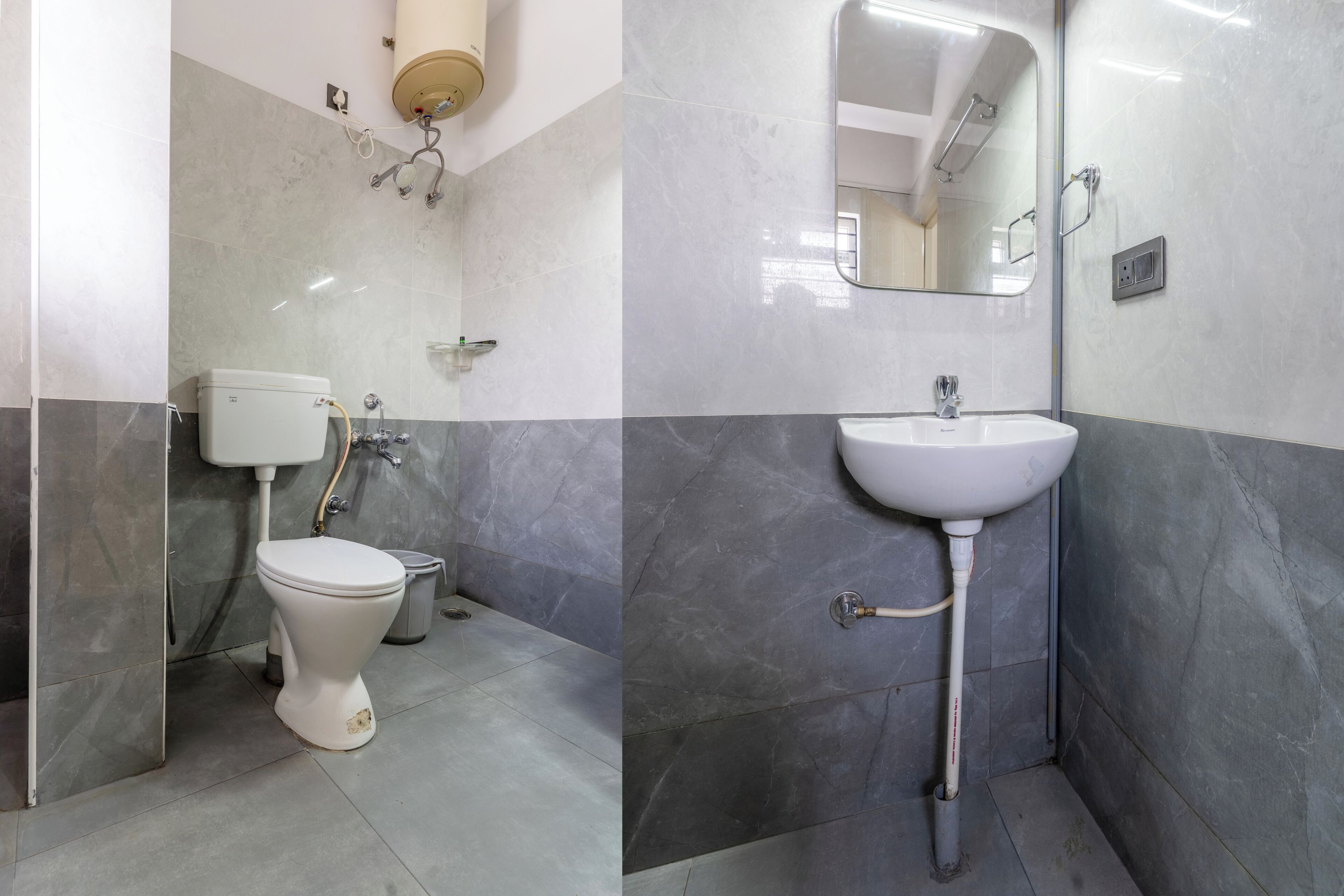 Une salle de bain équipée de toilettes, d’un lavabo, d’un miroir et de murs carrelés.