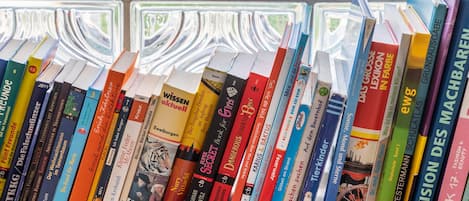 A bookshelf with a variety of books.