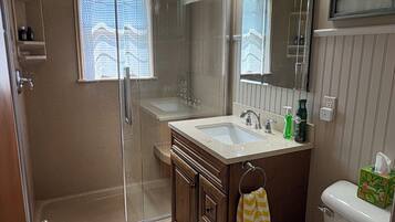 Shower, hair dryer, towels, soap
