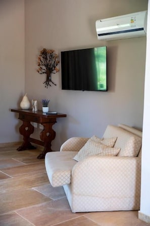 Suíte Deluxe, Varanda, Vista para a Montanha (1,2) | Área de sala de estar