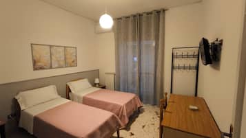 Family Room, Balcony, Courtyard View | Desk, laptop workspace, blackout drapes, iron/ironing board (on request)