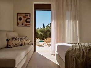 A room with a sofa, a bed, a view of an outdoor area with a pool and greenery. - Villa Aelionis, Private Pool, Furnished Terrace, Zakynthos (Zakynthos)