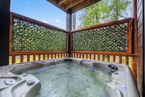 Private covered hot tub with wooded views and cozy rustic charm - 8-Bedroom Cabin with Themed Indoor Pool, Theater & Arcade Near Pigeon Forge (Sevierville)