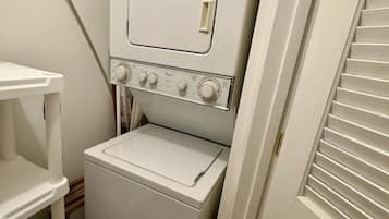A compact laundry room with a washing machine and dryer.