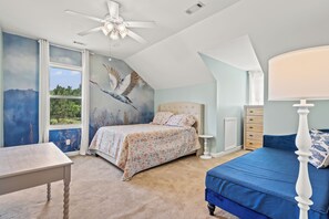 A bedroom with a bed, a desk, a dresser, and a ceiling fan. - Beautiful-Lakefront Farmhouse Retreat w/ Pool (Summerton)