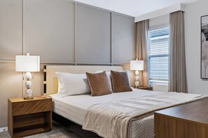 A hotel room with a large bed, two bedside tables with lamps, a window with curtains, and a painting on the wall. - 6BR house sleeps 16 in kissimmee, fl (Kissimmee)