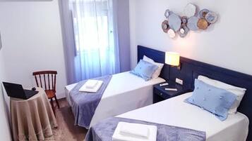 Desk, laptop workspace, blackout drapes, WiFi (free)