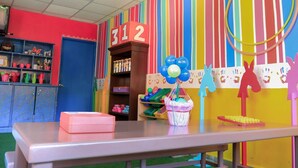 A classroom with a table, shelves, and educational decorations. - Awesome oceanfront resort with amazing Arch views in fabulous Cabo San Lucas (Cabo San Lucas)