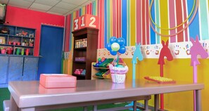 A classroom with a table, shelves, and educational decorations. - Awesome oceanfront resort with amazing Arch views in fabulous Cabo San Lucas (Cabo San Lucas)