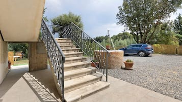 A staircase with metal railings leading to a building entrance.