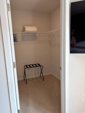 A closet with shelves, a bench, and a hanging rack. - Welcome to Your Pacific Northwest Retreat (Vancouver)