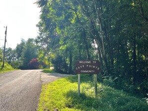 A road sign welcoming visitors to Cove Pointe Community.