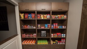 A pantry with various snacks and food items. - Accessible 1BR Suite w/ Free Hot Breakfast + Pool (Humble)