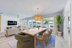 Slow mornings, long dinners — this table is where the memories happen. - Private Dock • Pool • Hot Tub • Puttputt • Games (St. Petersburg)