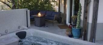 Watch the sunset from a private hot tub!