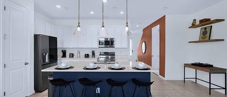 Coffee/tea maker, fridge, microwave, oven