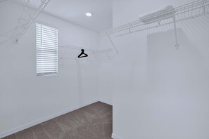 A room with a single window, a ceiling light, and a hanging clothes rack. - Disney Home w Lake View BBQ Patio & Resort Access (Davenport)