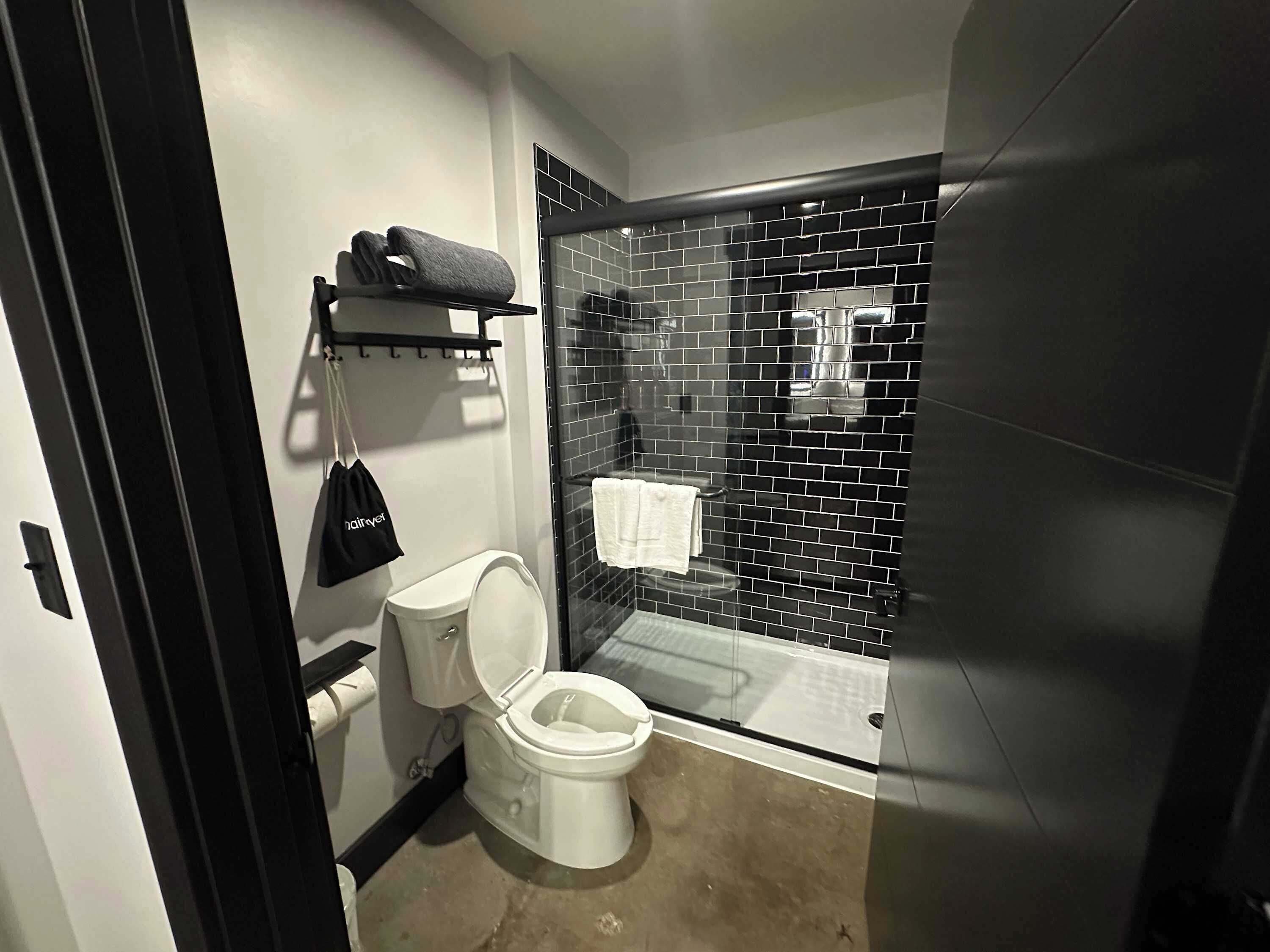 Shower, hair dryer, towels, shampoo