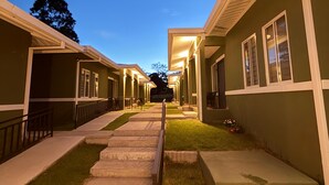 A pathway leading to a row of buildings with a clear sky above. - Luxury Apartment with Breathtaking Mountain Views | Pet-Friendly (Alto Boquete)