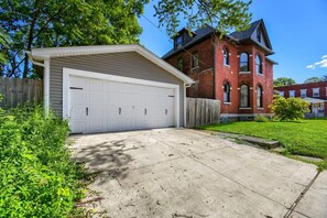 A residential property with a garage, a brick house, and a well-maintained lawn. - 3BR Victorian in Old Oaks, near German Village (Columbus)