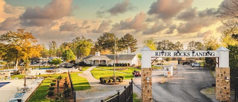 A gated entrance with a sign reading 'River Rocks Landing.'
