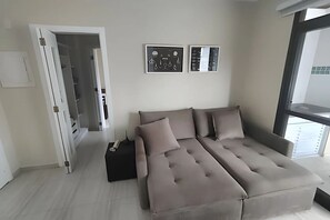 Deluxe Apartment | Living area - SHB Riviera Dreams com Piscina e Sauna  (Bertioga)