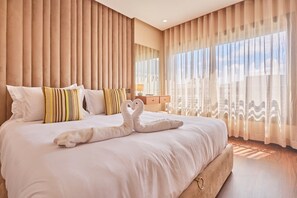 A hotel room with a large bed, a wooden headboard, and sheer curtains. - Casablanca 2BR | Free Parking Near Maarif (Casablanca)