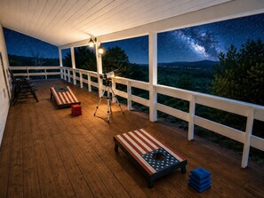 A covered outdoor deck with a telescope, benches, and a starry night view. - 200 Acre Retreat, Family Friendly, Stargazing, More (Hesperus)