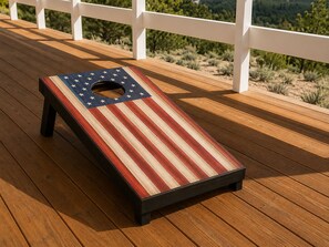 A wooden deck with a metal bench featuring a striped design. - 200 Acre Retreat, Family Friendly, Stargazing, More (Hesperus)