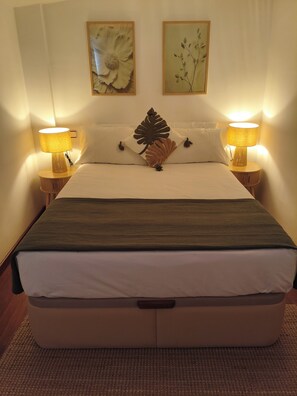 1 habitación, tabla de planchar con plancha, wifi y ropa de cama 