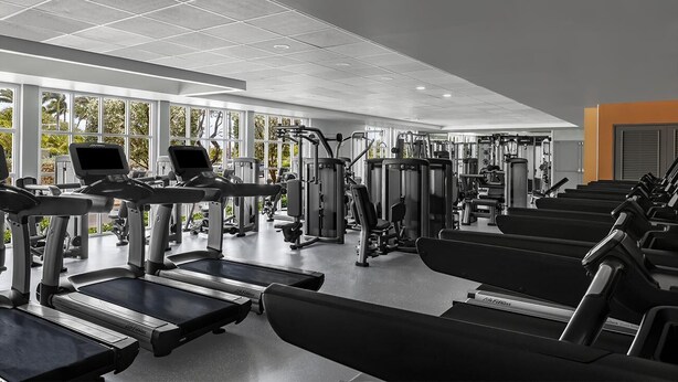 A gym with treadmills, weight machines, and exercise equipment. - OCEANFRONT- Beautiful 2 Bedroom-Marriott's Aruba Surf Club - Full Resort Access (Noord)