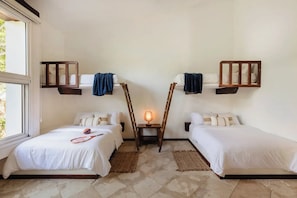 A hotel room with two beds, a window, and a lamp. - Luxury Family Villa on Yalku Lagoon · Private Cenote · Akumal (Tulum)