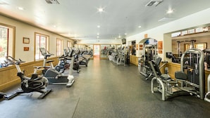 A gym with cardio machines, weight stations, and mirrors. - The Nest at Northstar by Tahoe Getaways - 3BR Walk to Northstar w HOA & Ski Shuttle! (Truckee)