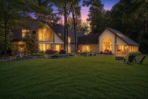 A two-story house with a well-maintained lawn and outdoor seating area. - Escape. Explore. Unwind.
Easy Access to Rice Lake, Golf, Trails, Snowmobiling. (Asphodel-Norwood)
