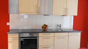 A kitchen with a Siemens oven, a sink, and a fruit bowl on the countertop. - Domblick Appartement/Fewo 4-Bettwohnung Nr. 2 by Interhome (Saas-Fee)