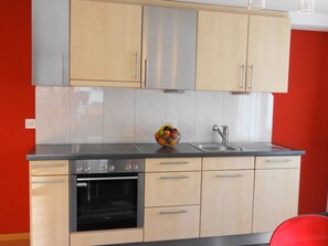 A kitchen with a Siemens oven, a sink, and a fruit bowl on the countertop. - Domblick Appartement/Fewo 4-Bettwohnung Nr. 2 by Interhome (Saas-Fee)