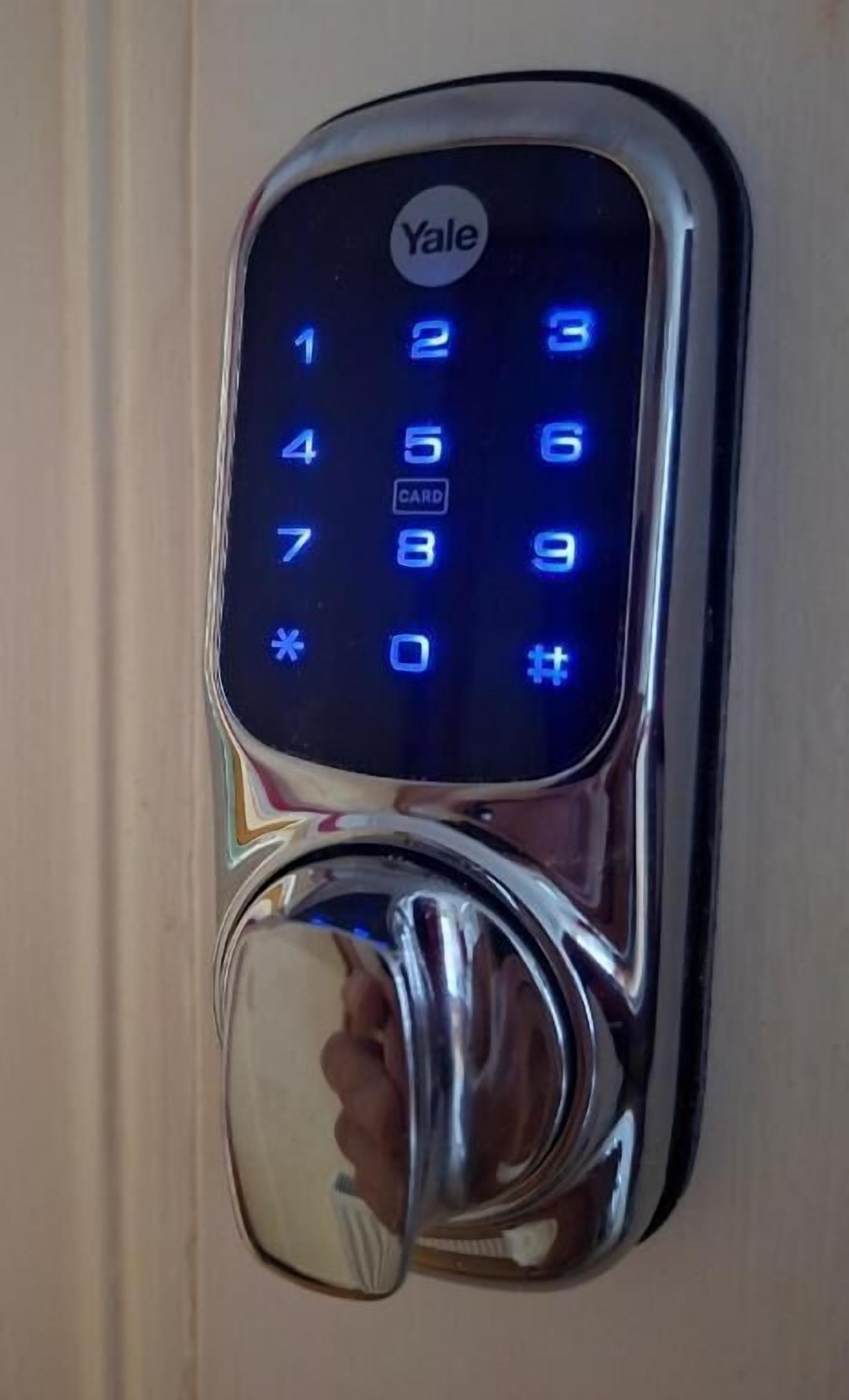 A Yale electronic keypad lock on a door.