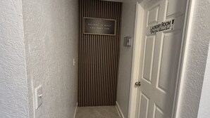 A hallway with a door labeled 'laundry room' and a sign that says 'Believe in what you pray for.' - Comfortable Home Near Disney ,Private Entrance & Free Parking (Davenport)