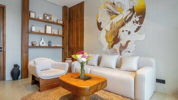 Deluxe Apartment, 1 Bedroom, Garden View | Living area | 50-inch Smart TV with digital channels
