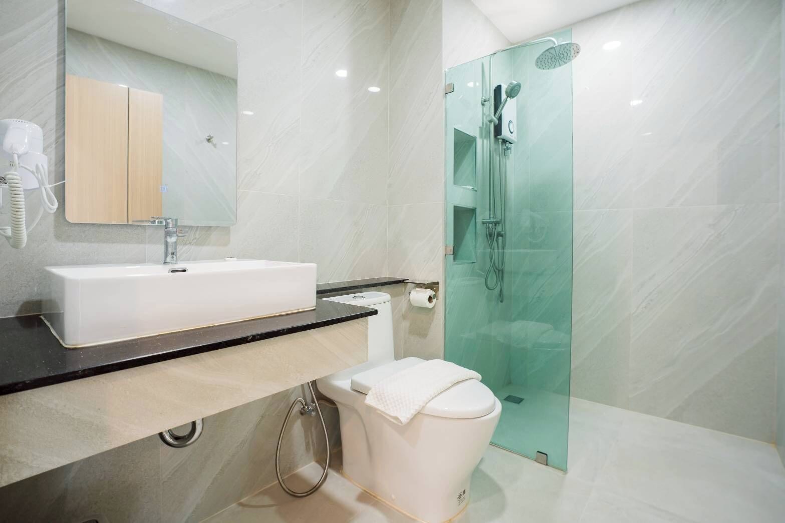 Shower, hair dryer, towels, soap