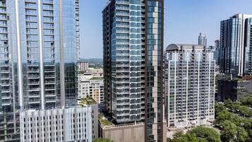 A high-rise building with multiple floors, large windows, and a modern architectural design.