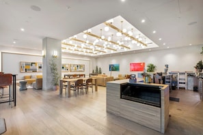 A modern interior with a dining area, kitchen, and living space. - 1211 ATX Longhorn Chic │ Hill Country Style, Rooftop Pool (Austin)