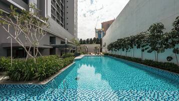 Outdoor pool, open 8:00 AM to 11:00 PM, pool loungers