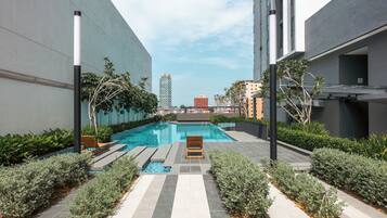 Outdoor pool, open 8:00 AM to 11:00 PM, pool loungers