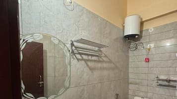 Shower, slippers, towels, toilet paper