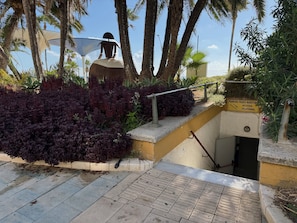 A staircase with a metal railing, surrounded by lush greenery and a clear sky. - Estepona Old Town! 3bed house 5min Walk to Beach (Estepona)