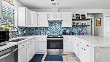 Coffee/tea maker, fridge, microwave, oven